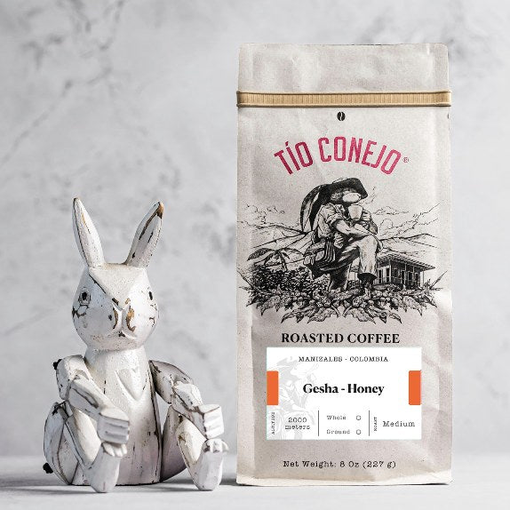 Gesha Honey next to the Tío Conejo wooden rabbit